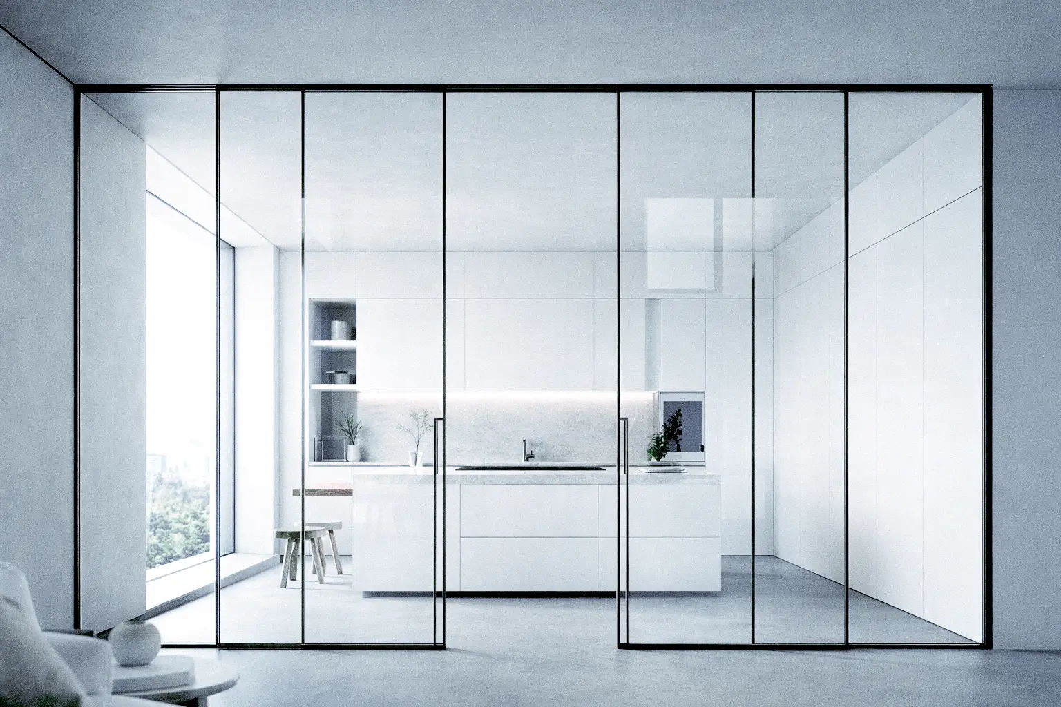 Porte a vetro a libro con binario a soffitto e pavimento continuo senza inciampi.